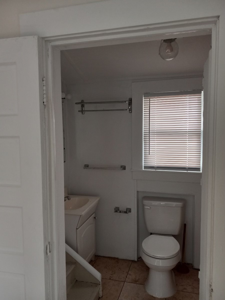 4309 Jack Street, Unit 3 Houston, TX 77006 - Photo 3 of 6 a bathroom with a toilet sink and window