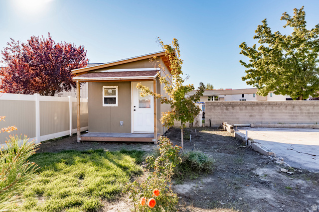 4658 Box Elder Street Salt Lake City, UT 84107 - Photo 17 of 17 Detached shed with an angled roof and a small front porch, featuring a white door and a single window