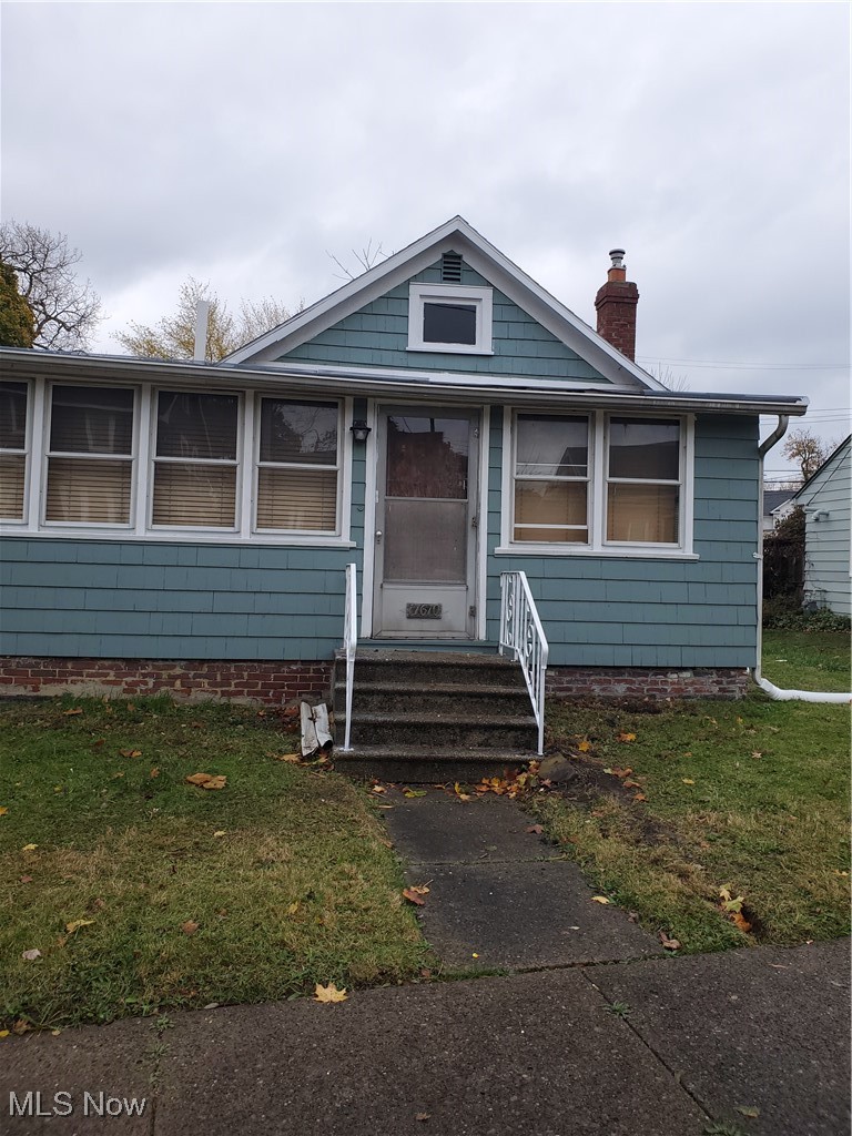 17610 Brazil Road Cleveland, OH 44119 - Photo 1 of 50 Bungalow-style home with a front lawn