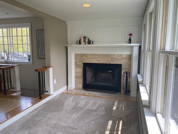 207 Highland Road Andover, MA 01810 - Photo 11 of 35 a living room with furniture and a fireplace