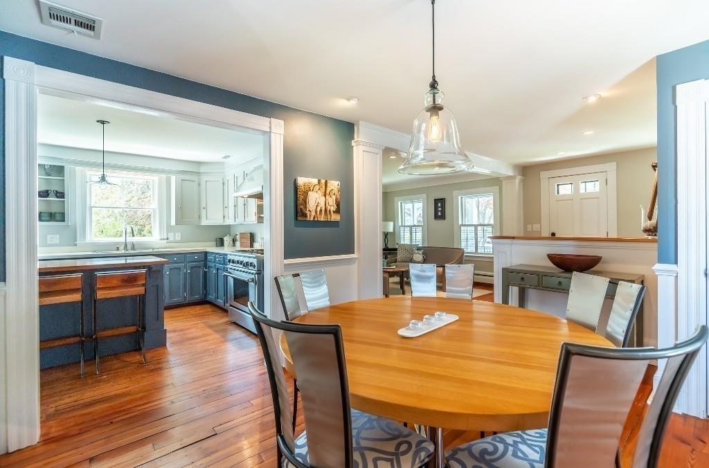 207 Highland Road Andover, MA 01810 - Photo 13 of 35 a view of a dining room with furniture and wooden floor
