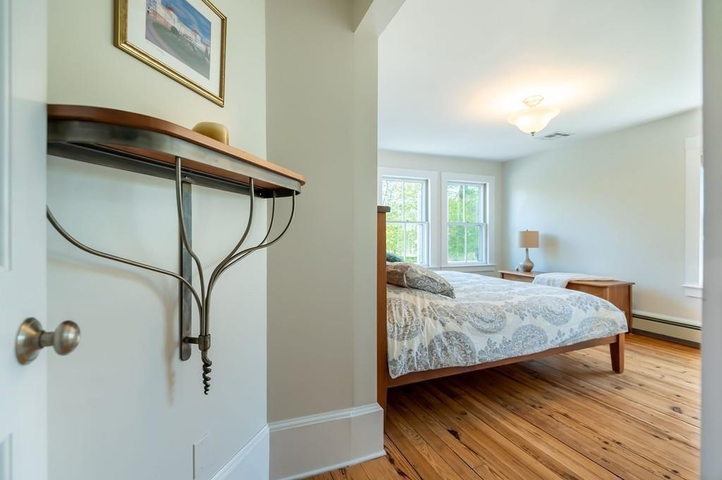 207 Highland Road Andover, MA 01810 - Photo 17 of 35 a bedroom with a bed and a mirror