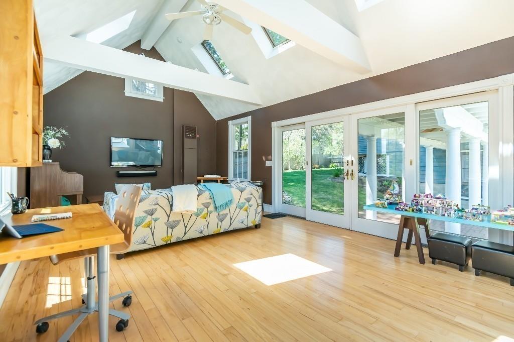 207 Highland Road Andover, MA 01810 - Photo 25 of 35 a living room with furniture floor to ceiling window and wooden floor