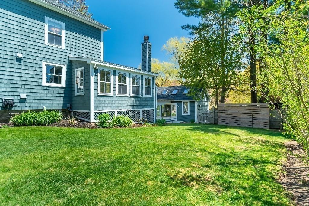 207 Highland Road Andover, MA 01810 - Photo 34 of 35 a view of a house with a yard and plants