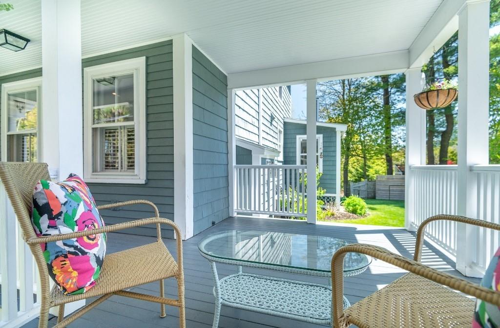 207 Highland Road Andover, MA 01810 - Photo 4 of 35 a view of a dining room with furniture large windows and wooden floor