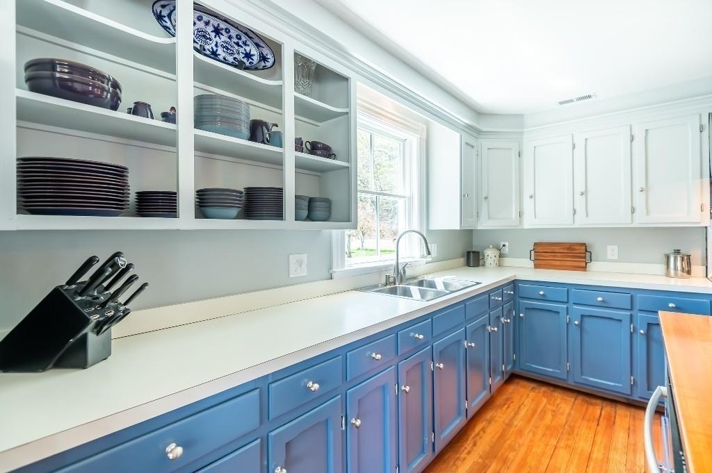 207 Highland Road Andover, MA 01810 - Photo 7 of 35 a kitchen with stainless steel appliances granite countertop a sink and cabinets