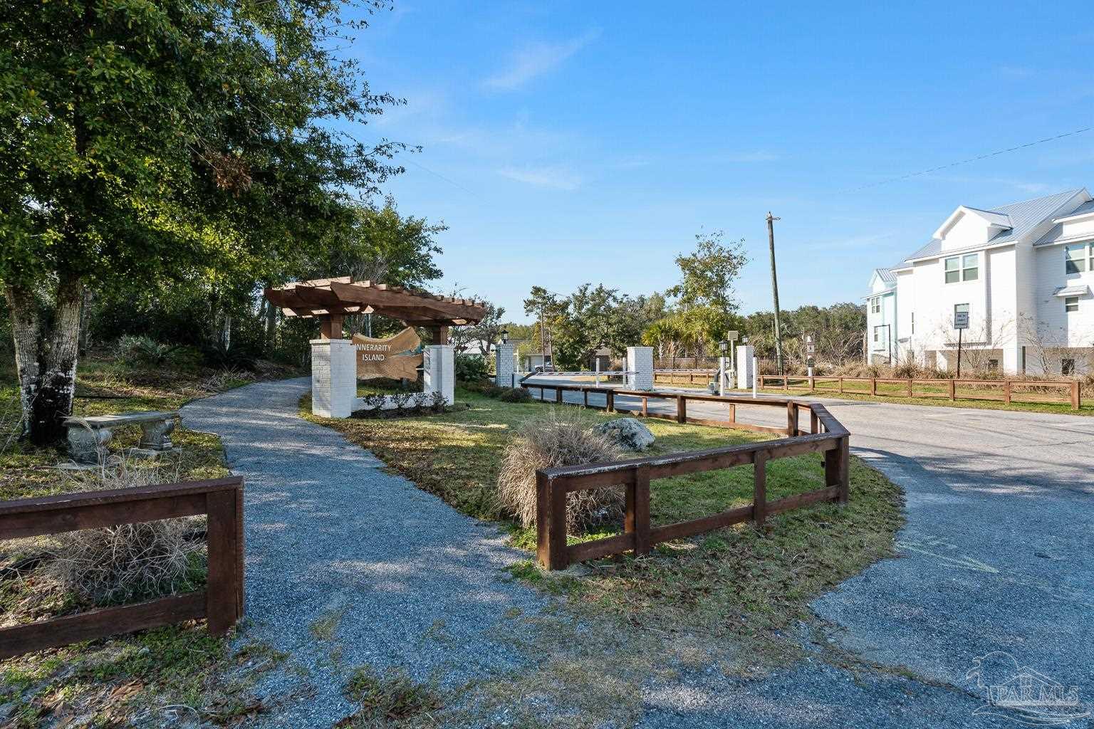 5400 North Shore Road Pensacola, FL 32507 - Photo 15 of 22 a park view with a bench and trees