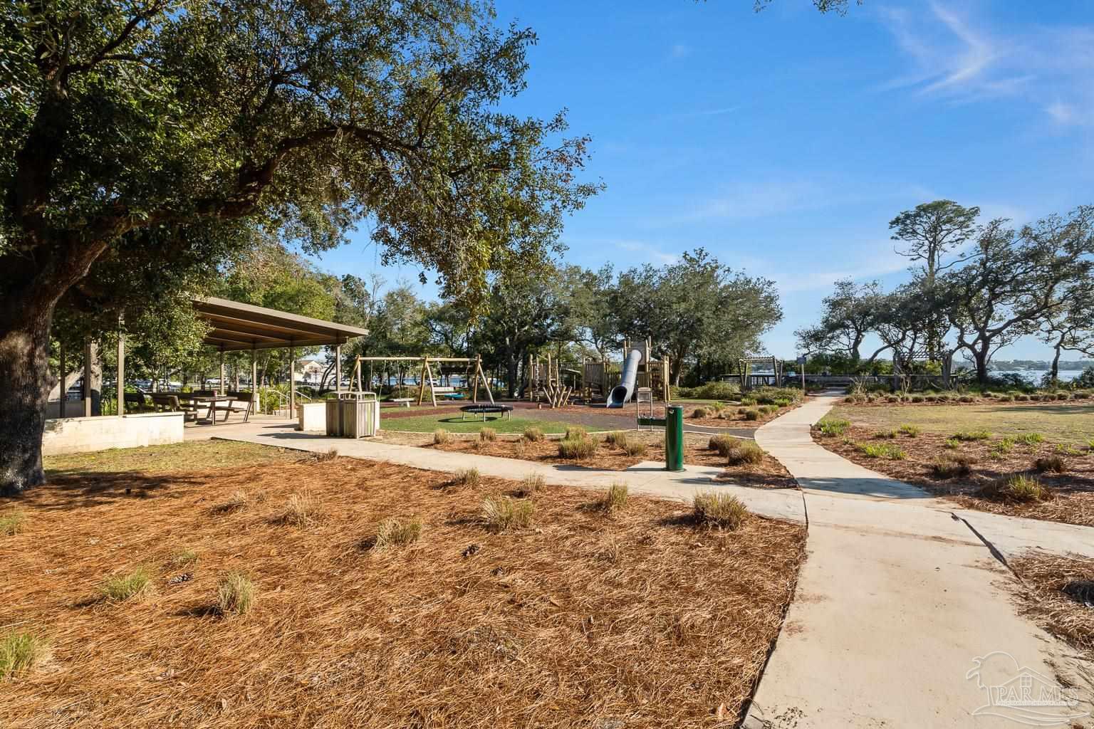 5400 North Shore Road Pensacola, FL 32507 - Photo 18 of 22 a view of a swimming pool with a patio