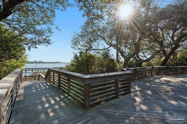 a view of a balcony with wooden floor and city view