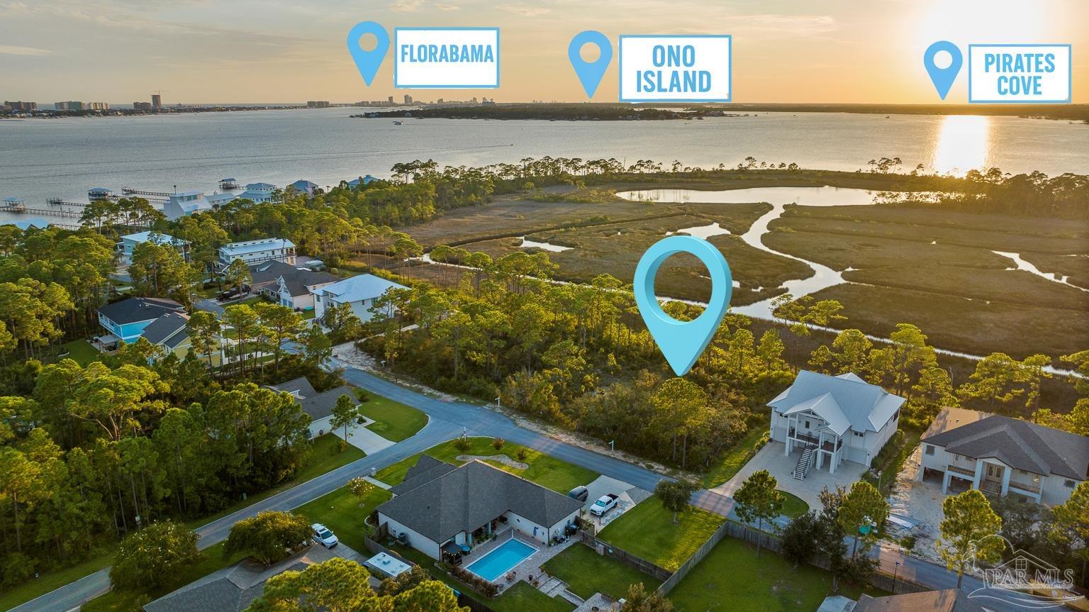 5400 North Shore Road Pensacola, FL 32507 - Photo 3 of 22 an aerial view of a house with outdoor space swimming pool and ocean view