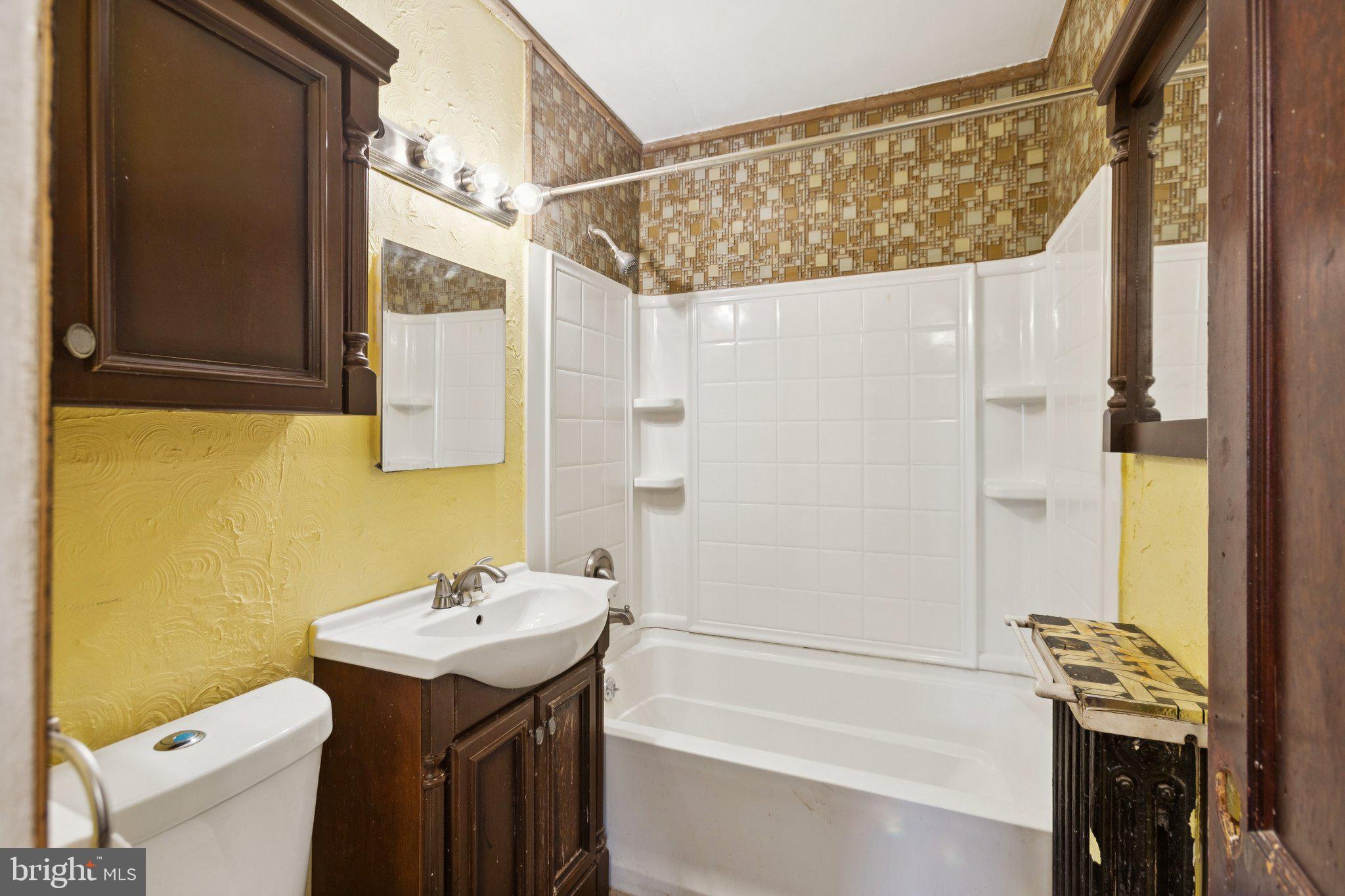 1633 R Street Southeast Washington, DC 20020 - Photo 16 of 44 a bathroom with a sink a toilet and a bathtub
