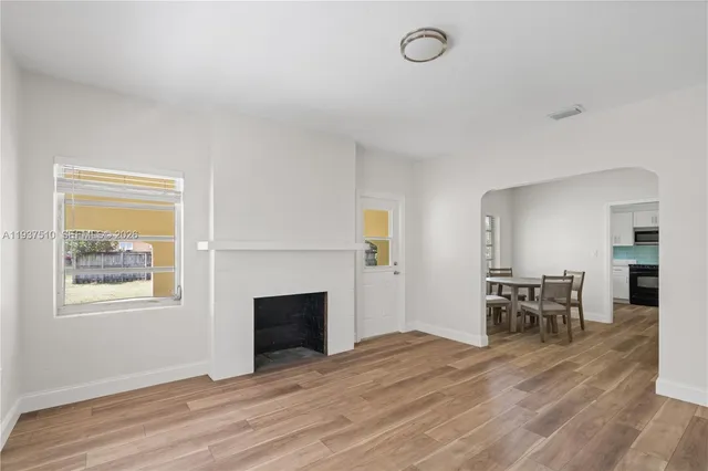 a view of a livingroom with furniture and a fireplace