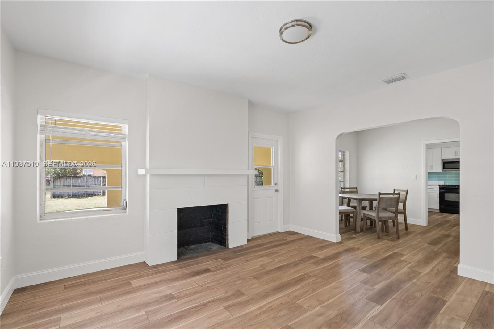 27 Northwest 21st Street Homestead, FL 33030 - Photo 3 of 10 a view of a livingroom with furniture and a fireplace