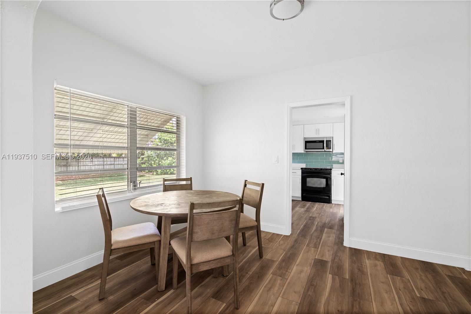 27 Northwest 21st Street Homestead, FL 33030 - Photo 5 of 10 a view of a dining room with furniture window and outside view