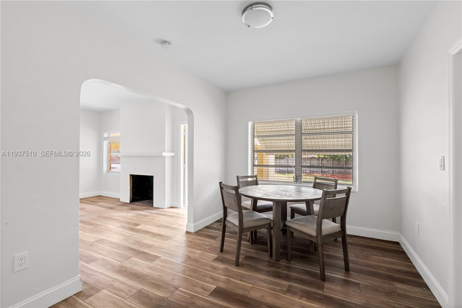 27 Northwest 21st Street Homestead, FL 33030 - Photo 10 of 10 a view of a dining room with furniture and fireplace