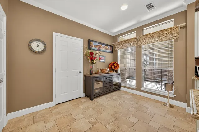 a kitchen with cabinets and stainless steel appliances