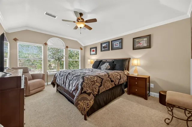 a spacious bathroom with a tub sink and mirror