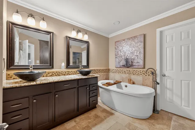 a bathroom with a bathtub and shower