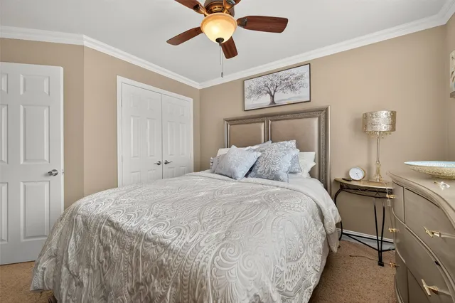 a bathroom with a granite countertop sink and a toilet