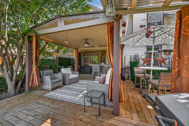 a view of living room kitchen with furniture and outdoor space