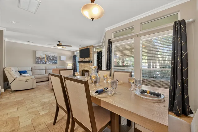 a view of a dining room with furniture window and outside view