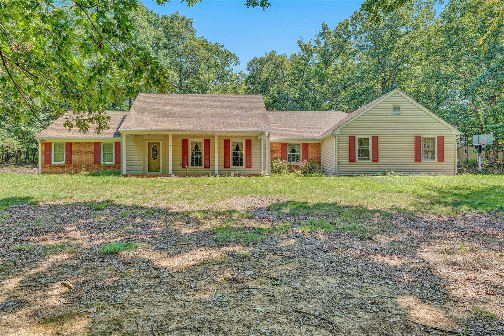 front view of a house with a yard