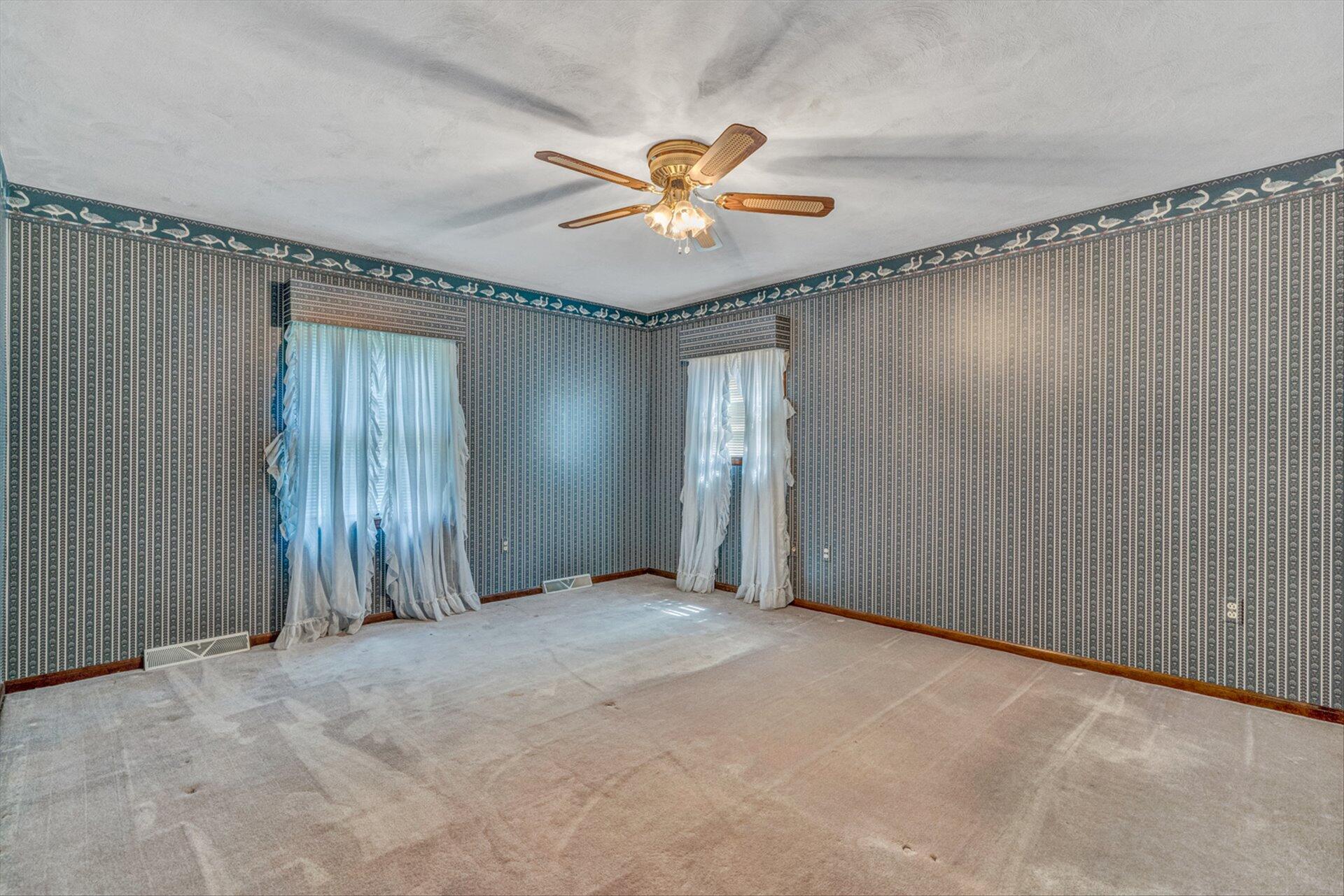 368 Foxcroft Drive Blue Ridge, VA 24064 - Photo 27 of 39 a view of an empty room with a ceiling fan