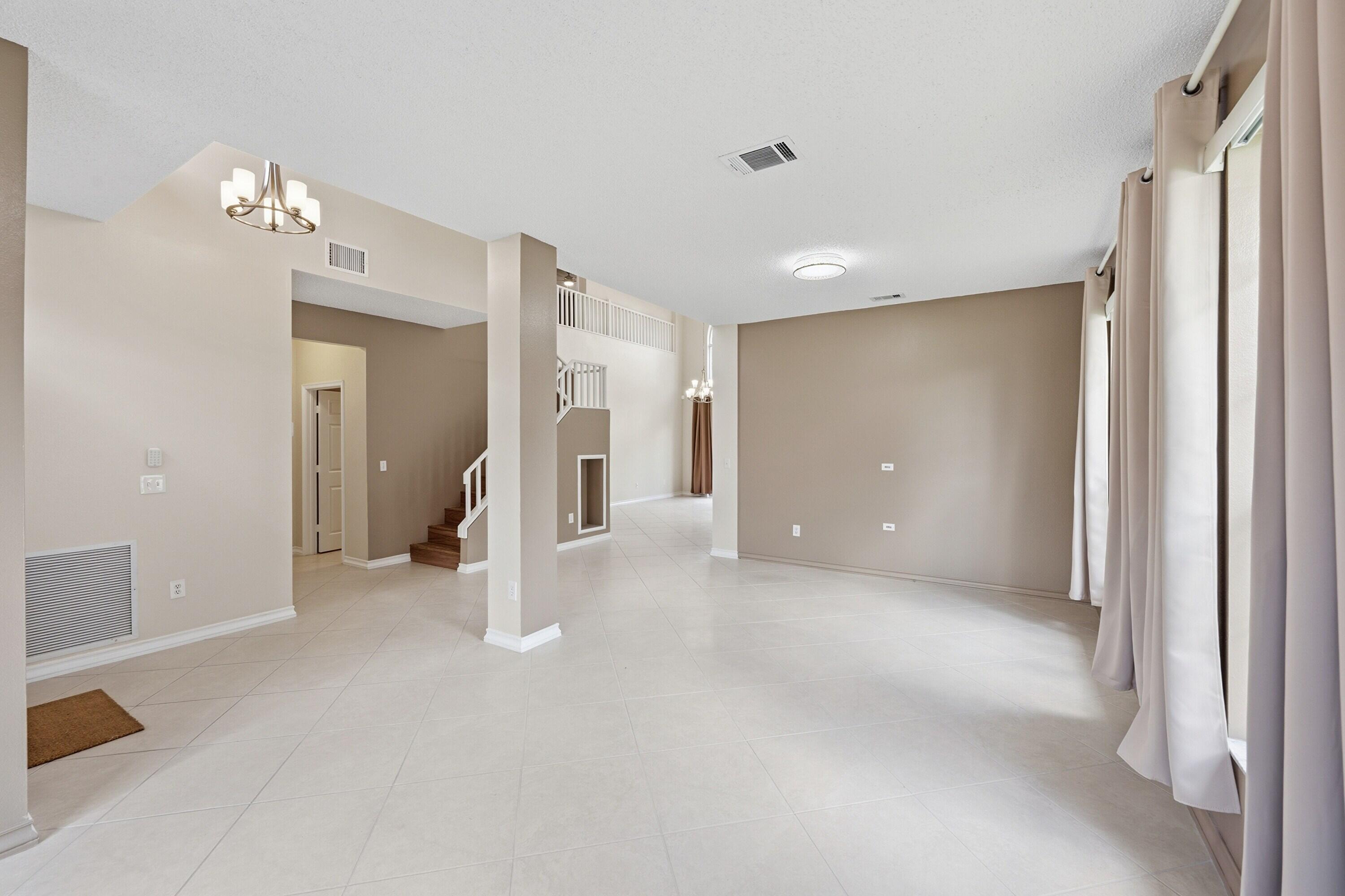18474 Old Princeton Lane Boca Raton, FL 33498 - Photo 8 of 46 a view of a livingroom with a chandelier