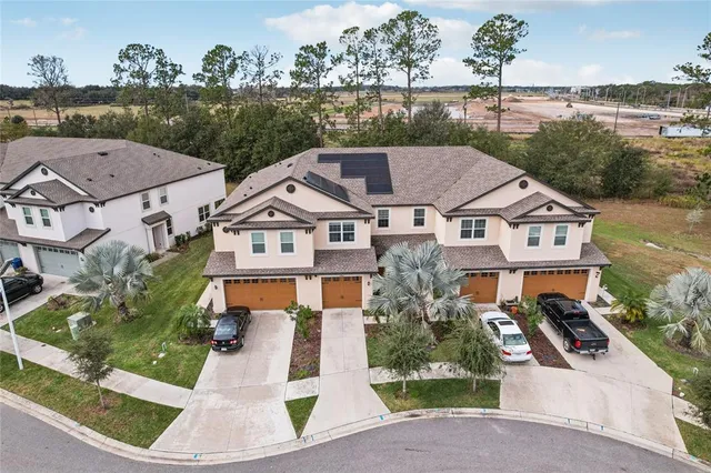 an aerial view of a house with a garden