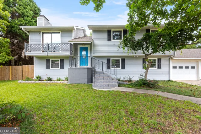 front view of a house with a yard
