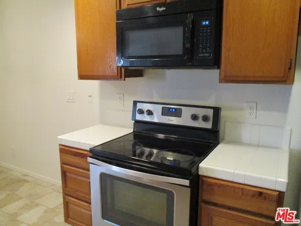 a kitchen with a stove and a microwave