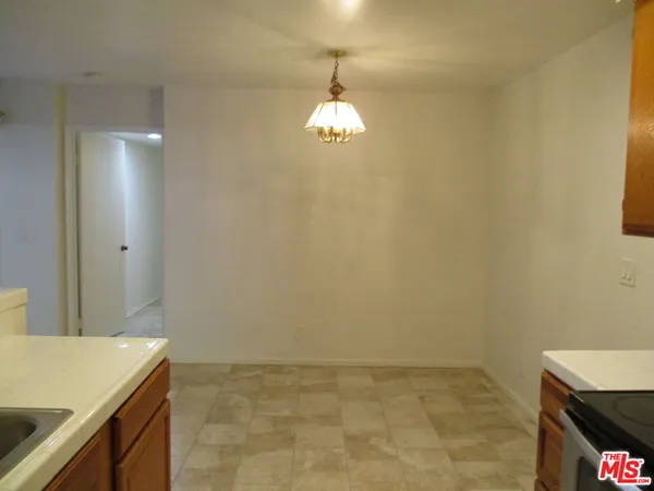 a bathroom with a sink and a granite countertop