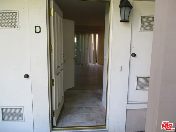 a view of a bathroom from a hallway