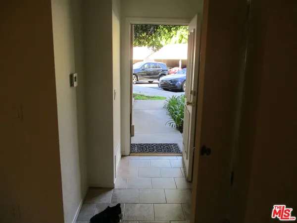 a view of hallway with wooden floor