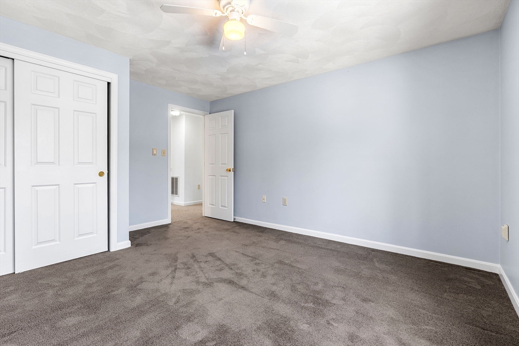 4 Iris Way, Unit 22 Haverhill, MA 01830 - Photo 11 of 38 an empty room with a natural light