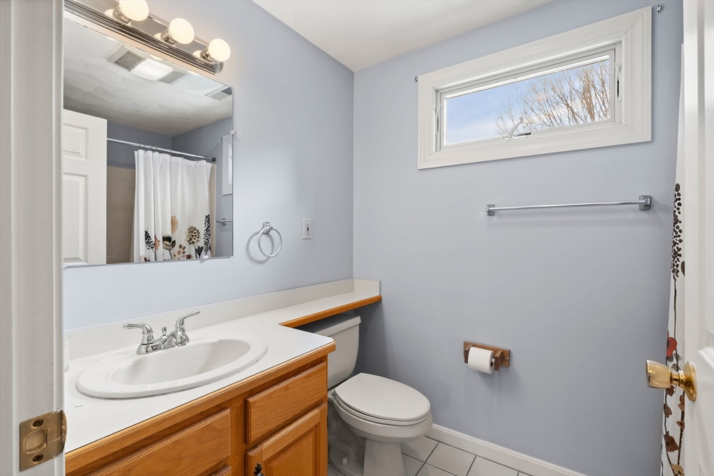 4 Iris Way, Unit 22 Haverhill, MA 01830 - Photo 14 of 38 a bathroom with a toilet sink and mirror