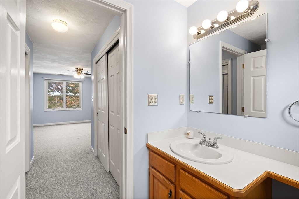 4 Iris Way, Unit 22 Haverhill, MA 01830 - Photo 15 of 38 a en suite bathroom with a sink double vanity and a mirror
