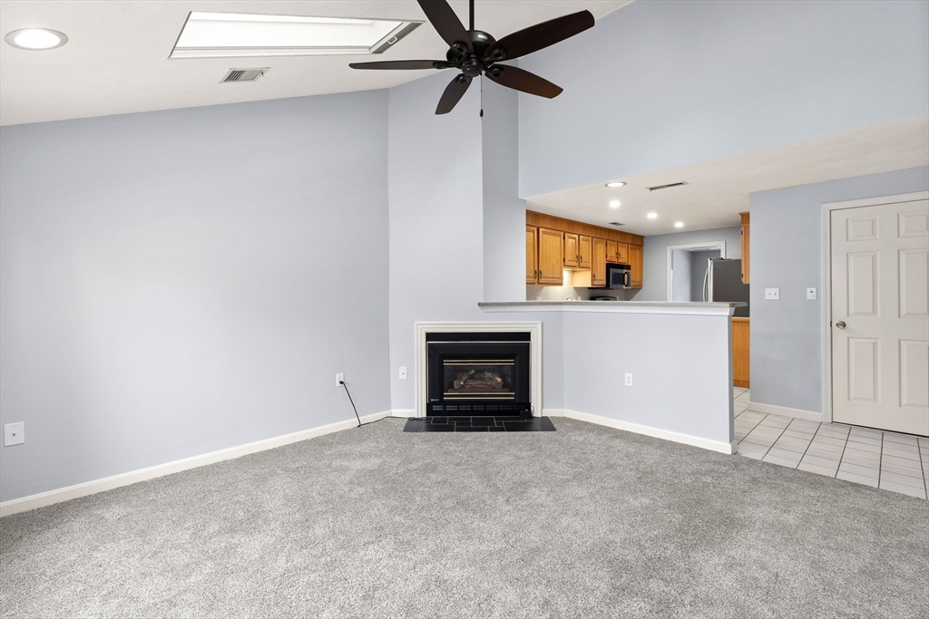4 Iris Way, Unit 22 Haverhill, MA 01830 - Photo 18 of 38 an empty room with a fireplace and a window