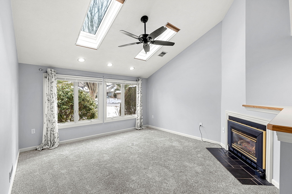 4 Iris Way, Unit 22 Haverhill, MA 01830 - Photo 20 of 38 wooden floor in an empty room with a fireplace