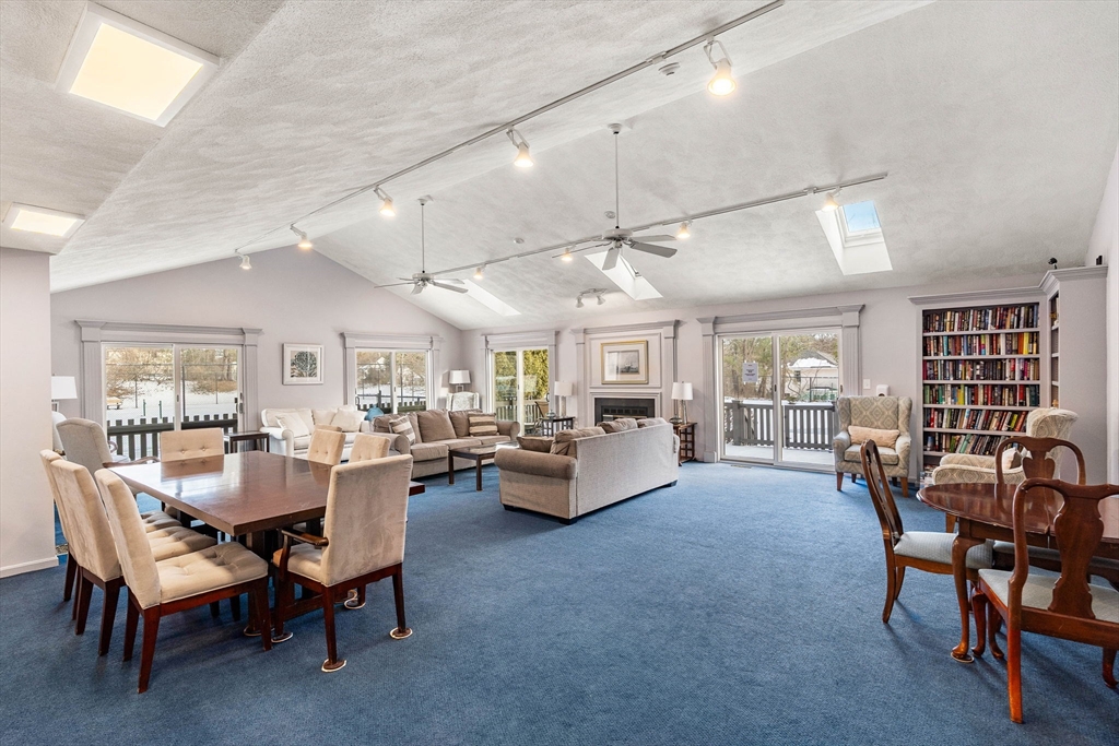 4 Iris Way, Unit 22 Haverhill, MA 01830 - Photo 33 of 38 a living room with furniture and wooden floor