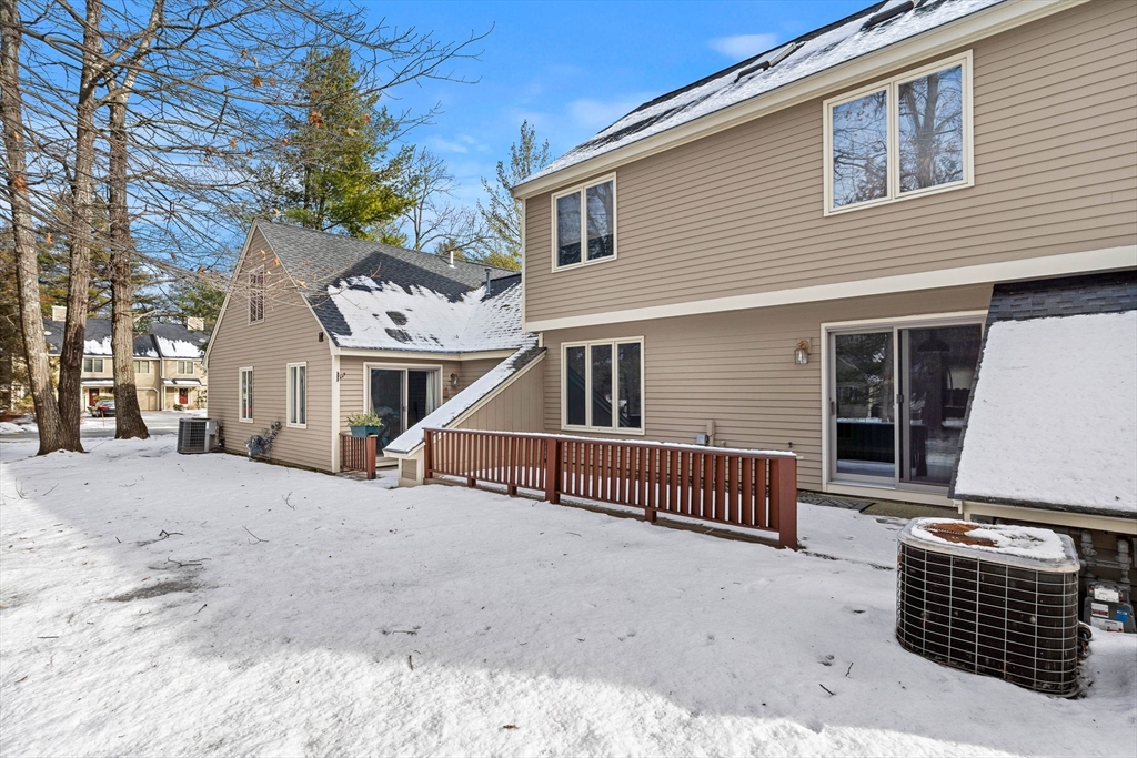 4 Iris Way, Unit 22 Haverhill, MA 01830 - Photo 4 of 38 a view of a house with a yard