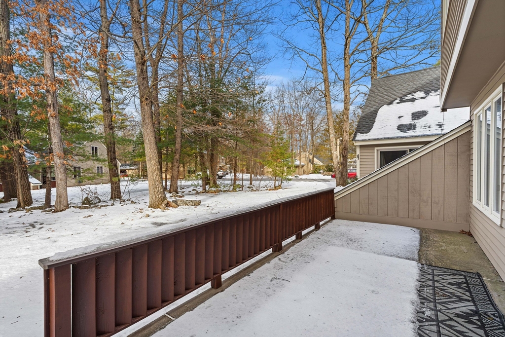 4 Iris Way, Unit 22 Haverhill, MA 01830 - Photo 5 of 38 a view of terrace with sink and wooden fence