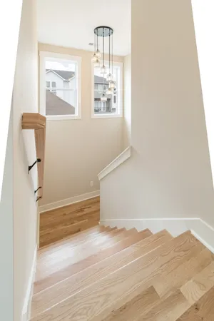 a view of hallway with wooden floor