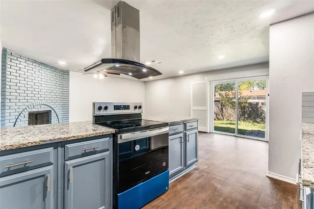a kitchen with a stove and a microwave