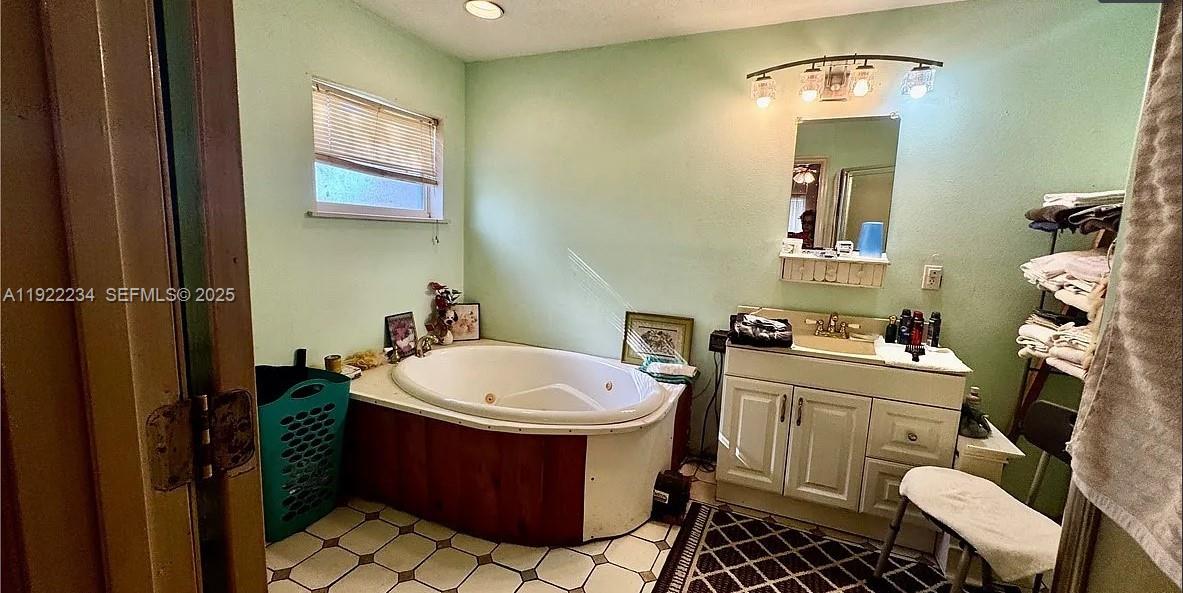 8055 Twitty Road Sebring, FL 33876 - Photo 12 of 19 a bathroom with a sink toilet and shower