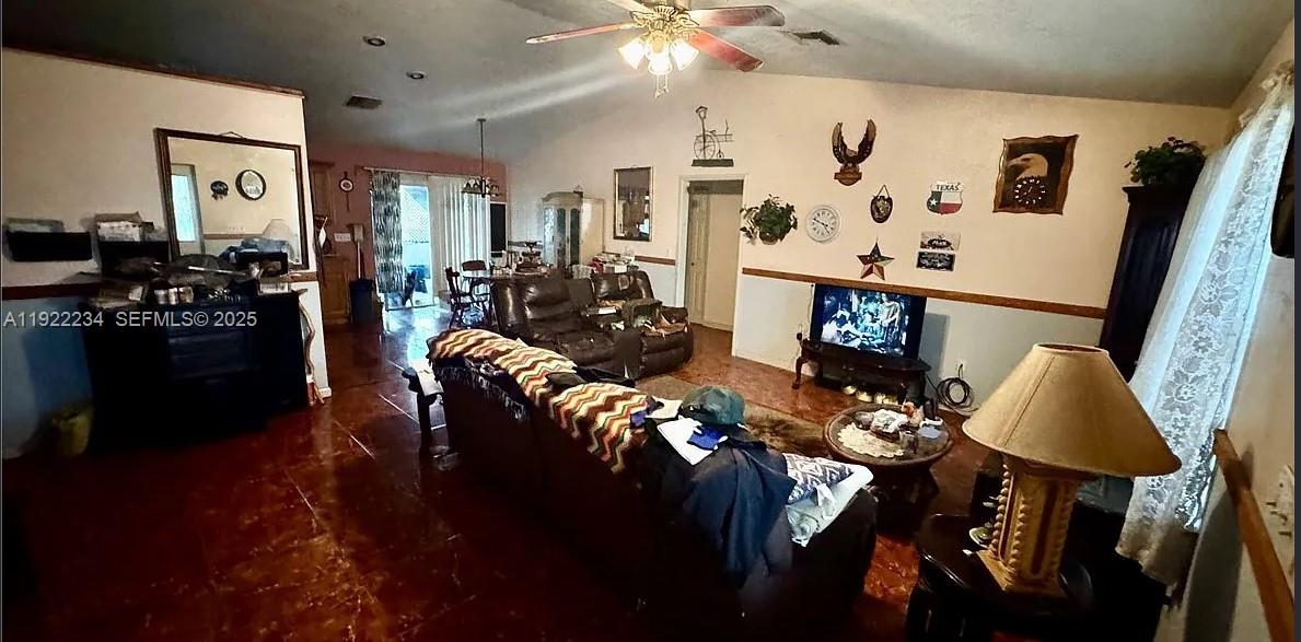 8055 Twitty Road Sebring, FL 33876 - Photo 6 of 19 a living room with furniture and wooden floor