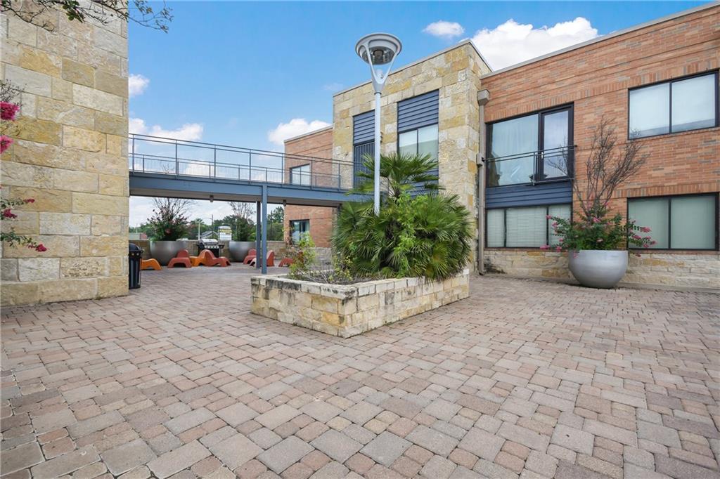 3016 Guadalupe Street, Unit 203 Austin, TX 78705 - Photo 14 of 16 a view of a building with sitting area