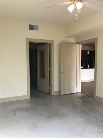 a bathroom with a granite countertop sink and a bathtub