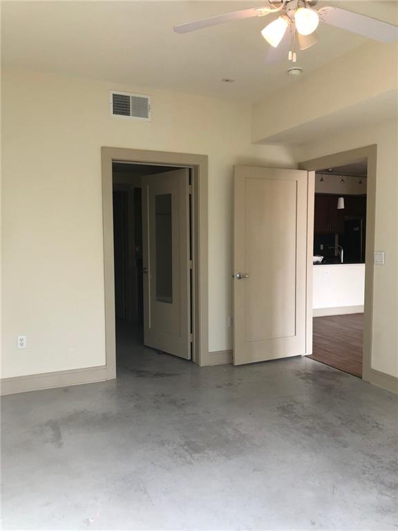 3016 Guadalupe Street, Unit 203 Austin, TX 78705 - Photo 10 of 16 wooden floor and window in an empty room