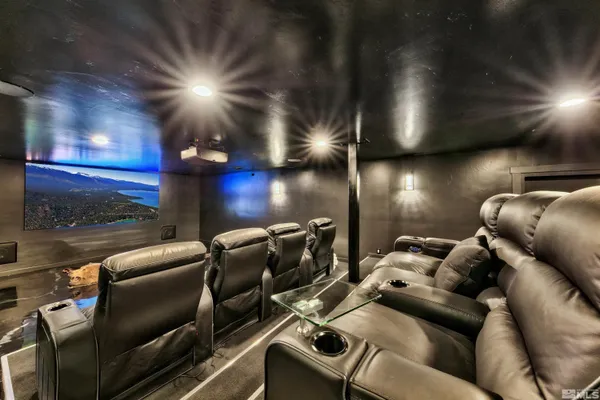 a media room with lots of chairs and a projector